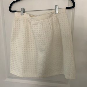 Cream skirt with gold zipper detail